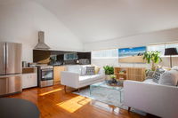 Sunlit Two-Bedroom Unit With Sprawling BBQ Deck - Click Find