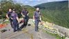 A woman died after falling more than 100 feet from a waterfall overlook on the Blue Ridge Parkway in North Carolina