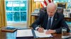 Biden signs debt ceiling deal into law, averting historic default