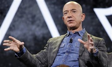 Jeff Bezos vows to give away most of fortune – and hands Dolly Parton $100m