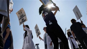 Kaiser Permanente workers are on strike. Here's what makes it such a unique health care company