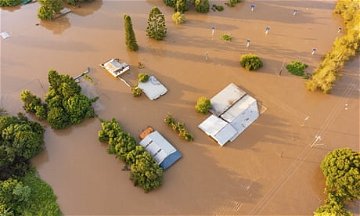 Labor criticises Coalition for not spending more from emergency fund amid severe flooding