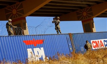 Texas national guard soldier shoots and wounds migrant at Mexico border