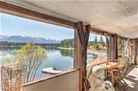 Luxe Lakefront Haven with Mountain Views  Dock