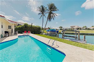 New Listing! Canal-Side Home W/ Pool & Boat Dock Home